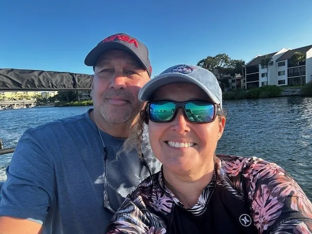 Carlos and Liza, the family behind Boss Life Rentals, on the water in Sarasota.